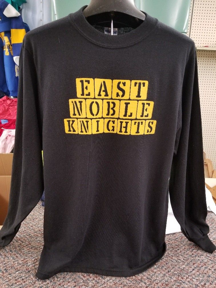 Custom merchandise printing on black sweatshirt with yellow print in Kendallville, IN for branded apparel and group orders