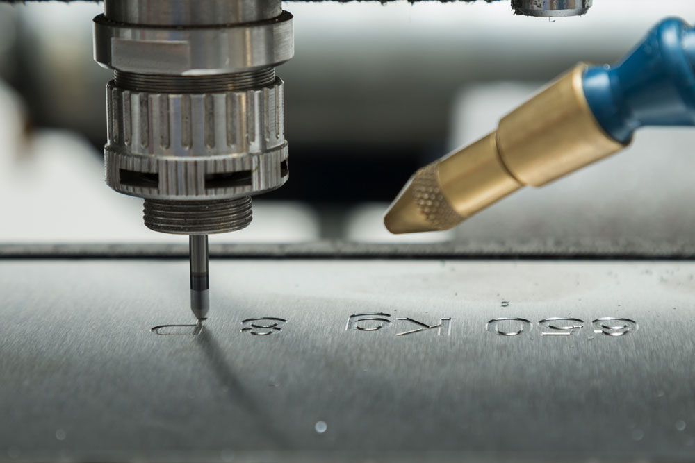Metal piece receiving precision custom engraving
